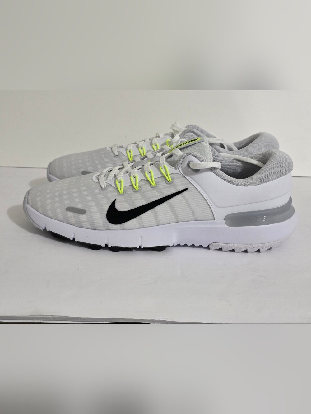 Nike Men’s White & Grey Athletic Sneakers with Black Swoosh